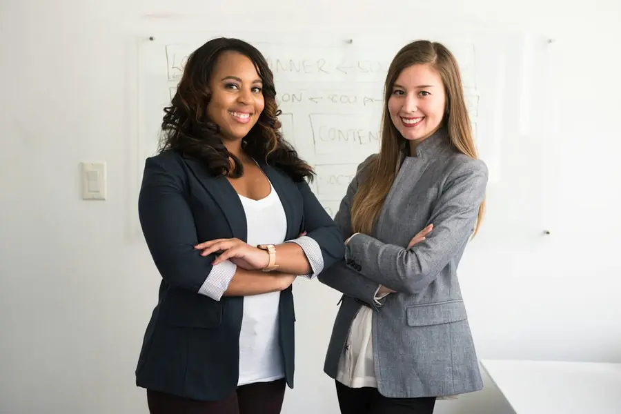 Two business owners reviewing paperwork